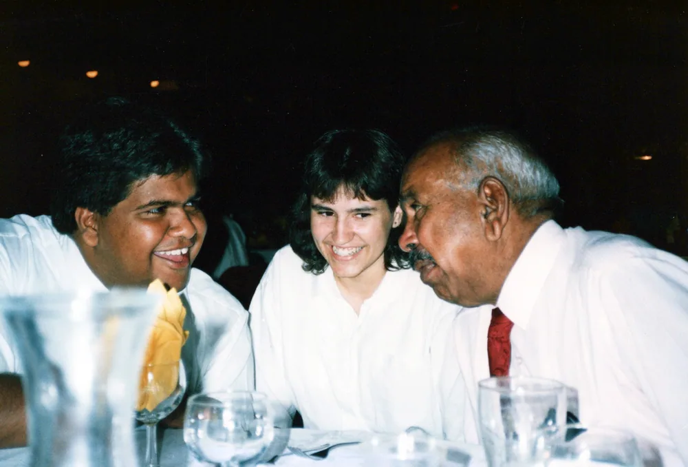Guests at a dinner table.