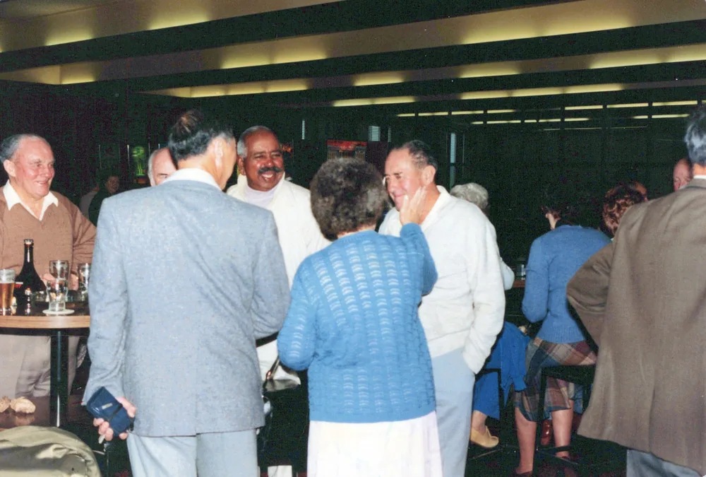 Guests gathered in a function room.
