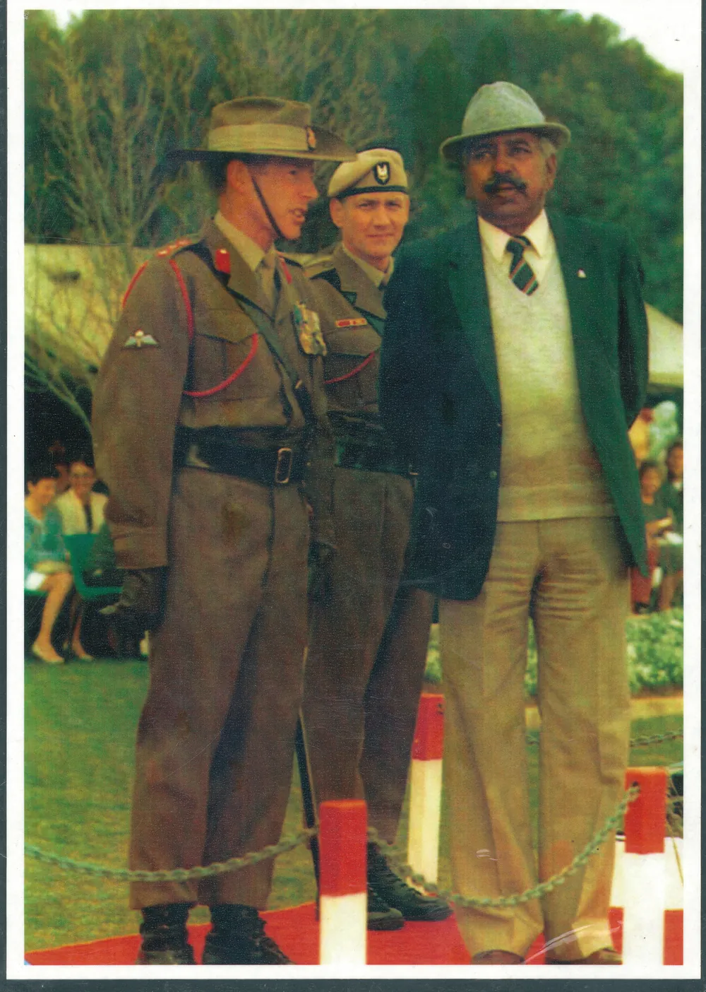 Two soldiers in slouch hats with a gentleman.