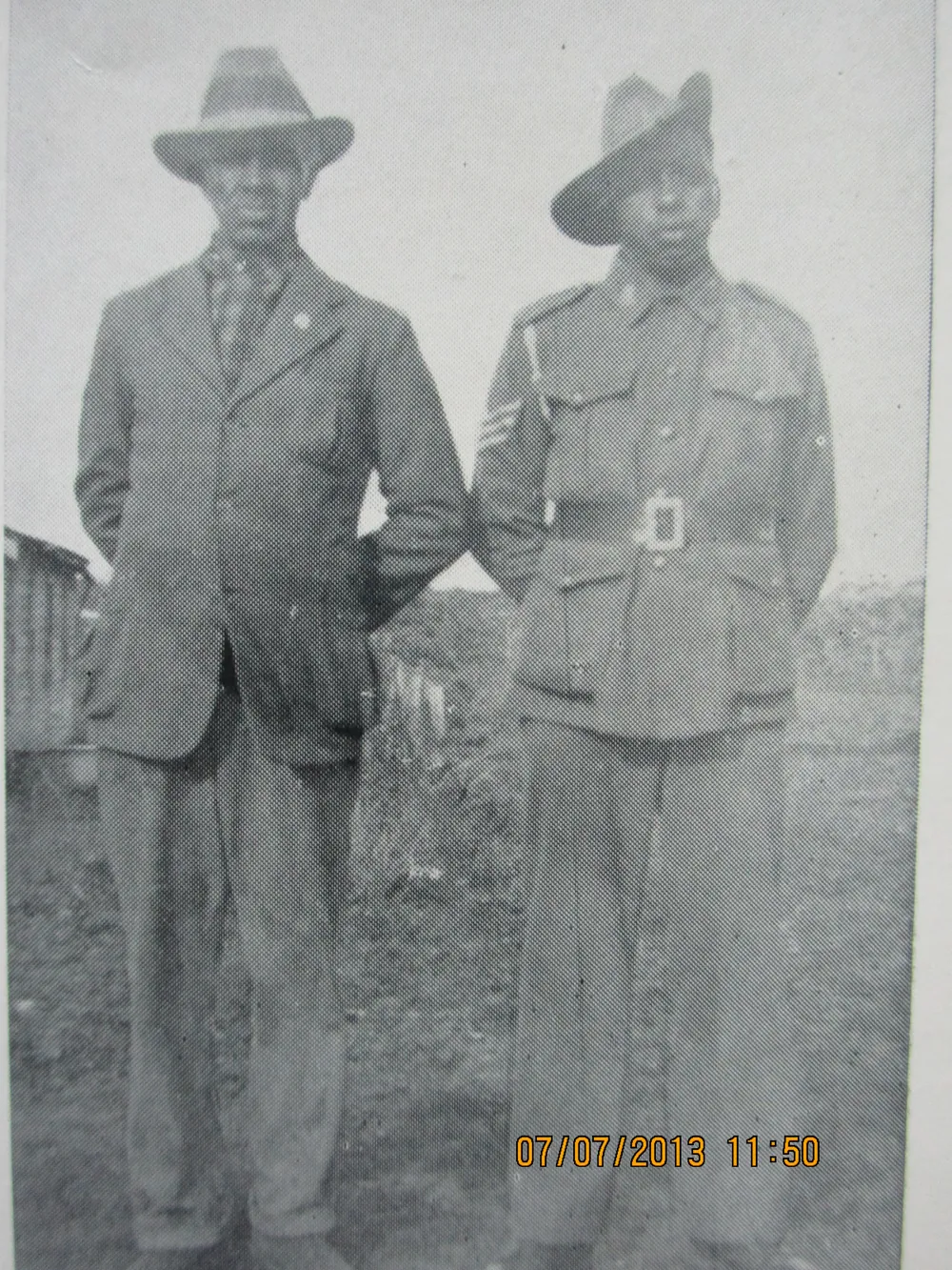 Two men in uniform.