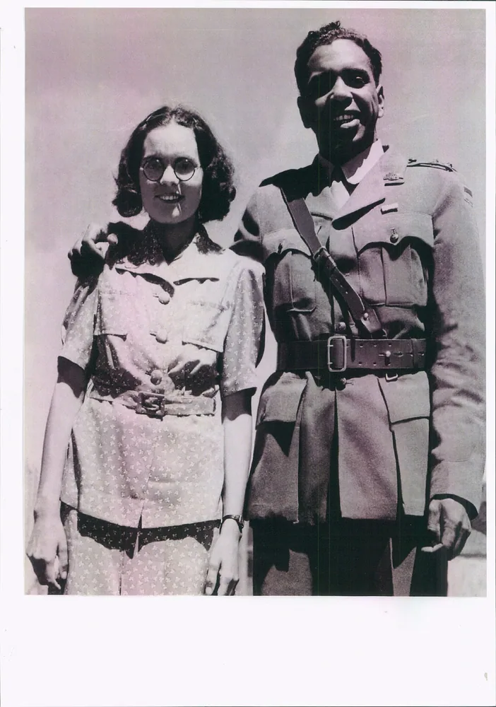 A couple photographed together, one in service dress.