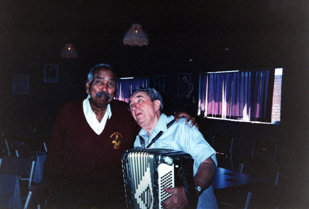 Music at a function, one man with an accordion.