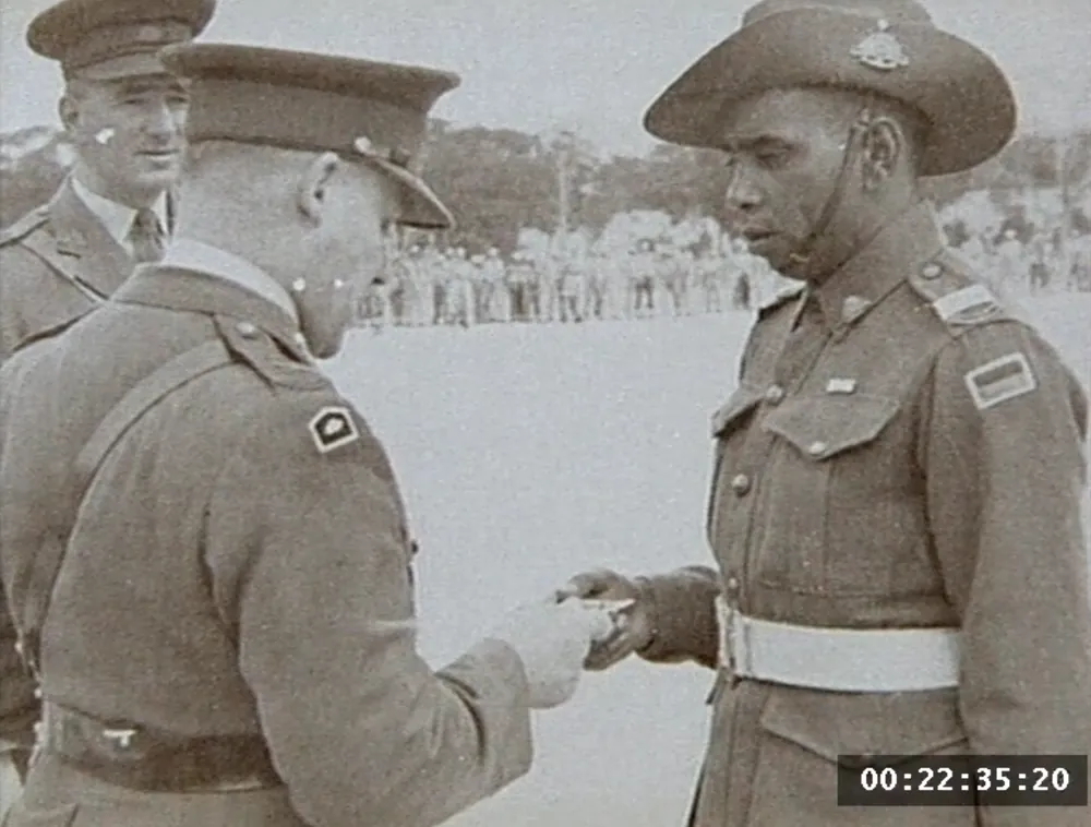 Officers shaking hands on parade.