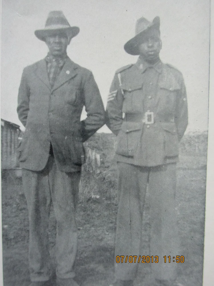 Two soldiers photographed standing together.