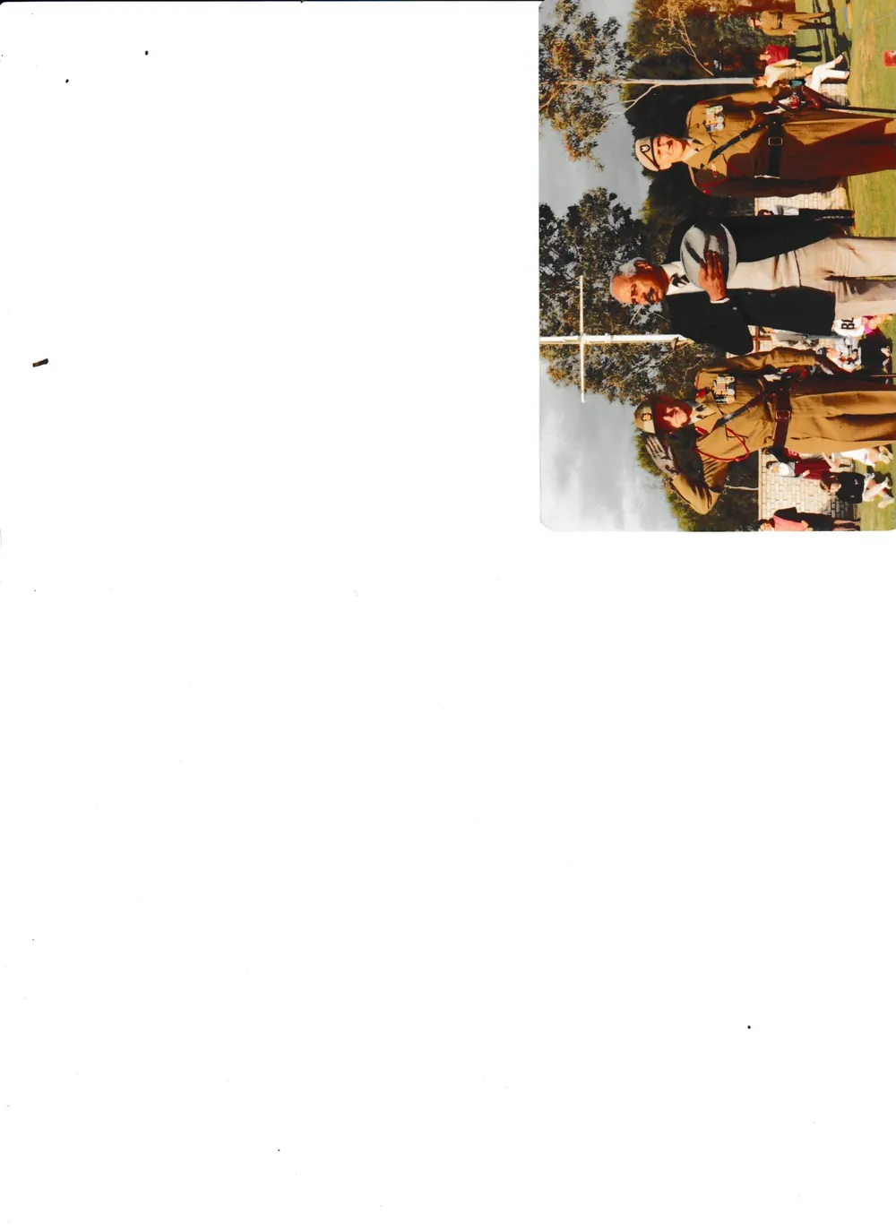 A group gathered outdoors, small print.