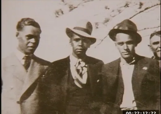 Three men photographed together, early sepia print.