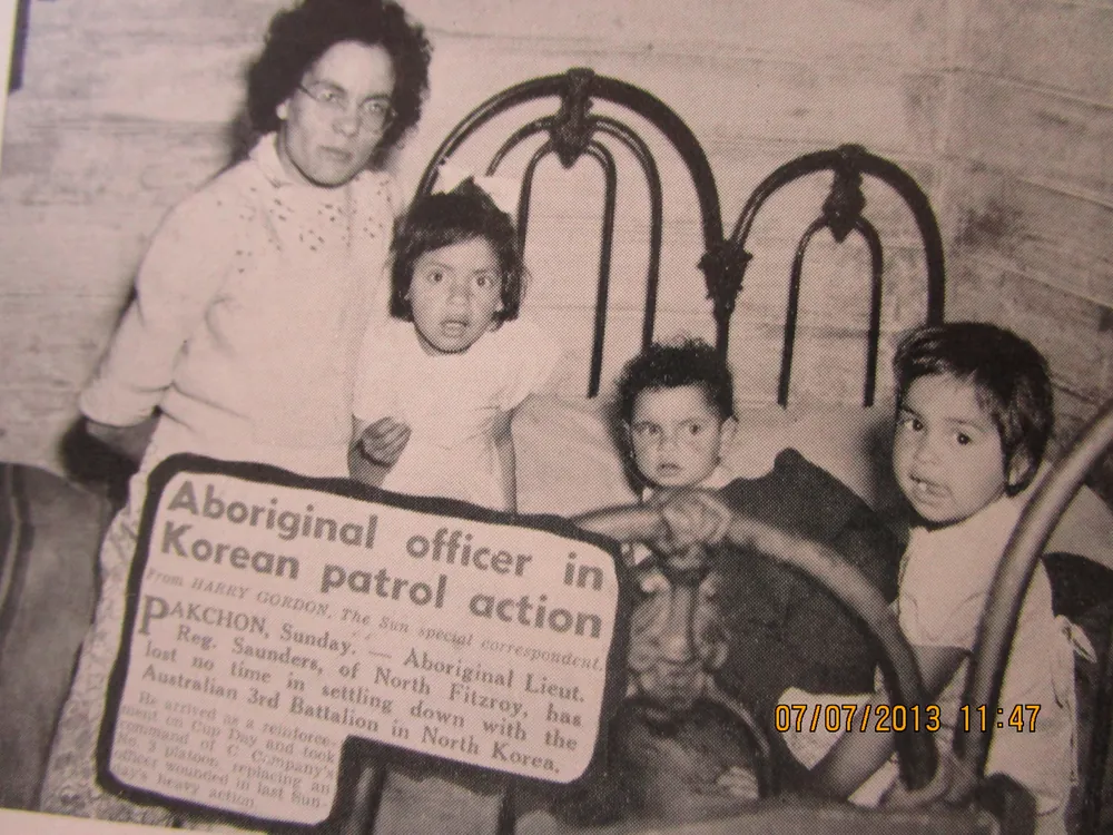 Family group with a press clipping.