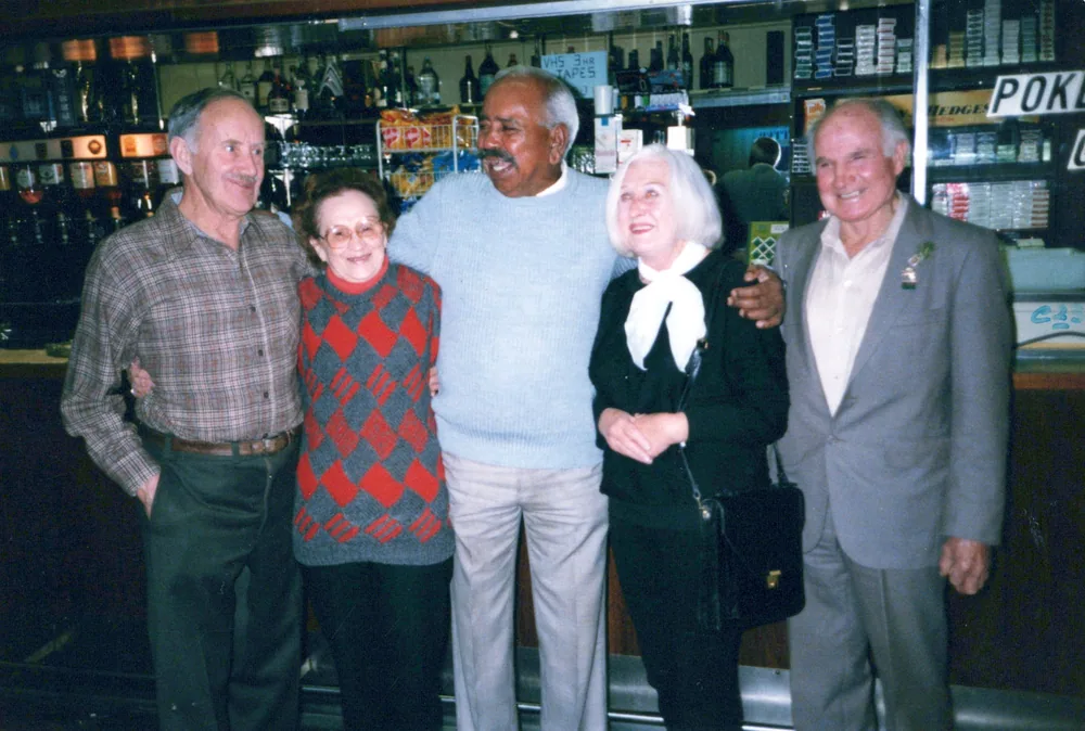 A group photographed at a bar.