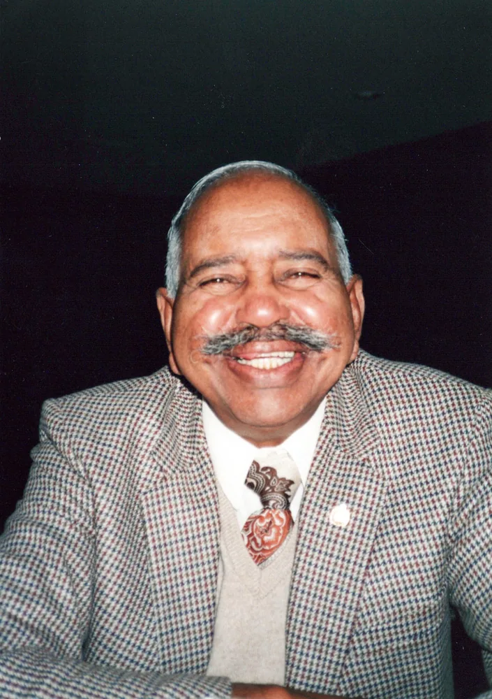 Portrait of a man in a suit.
