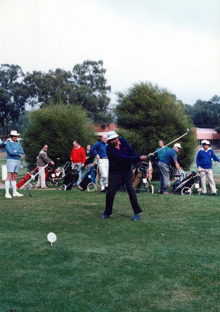 An outdoor lawn game in progress.