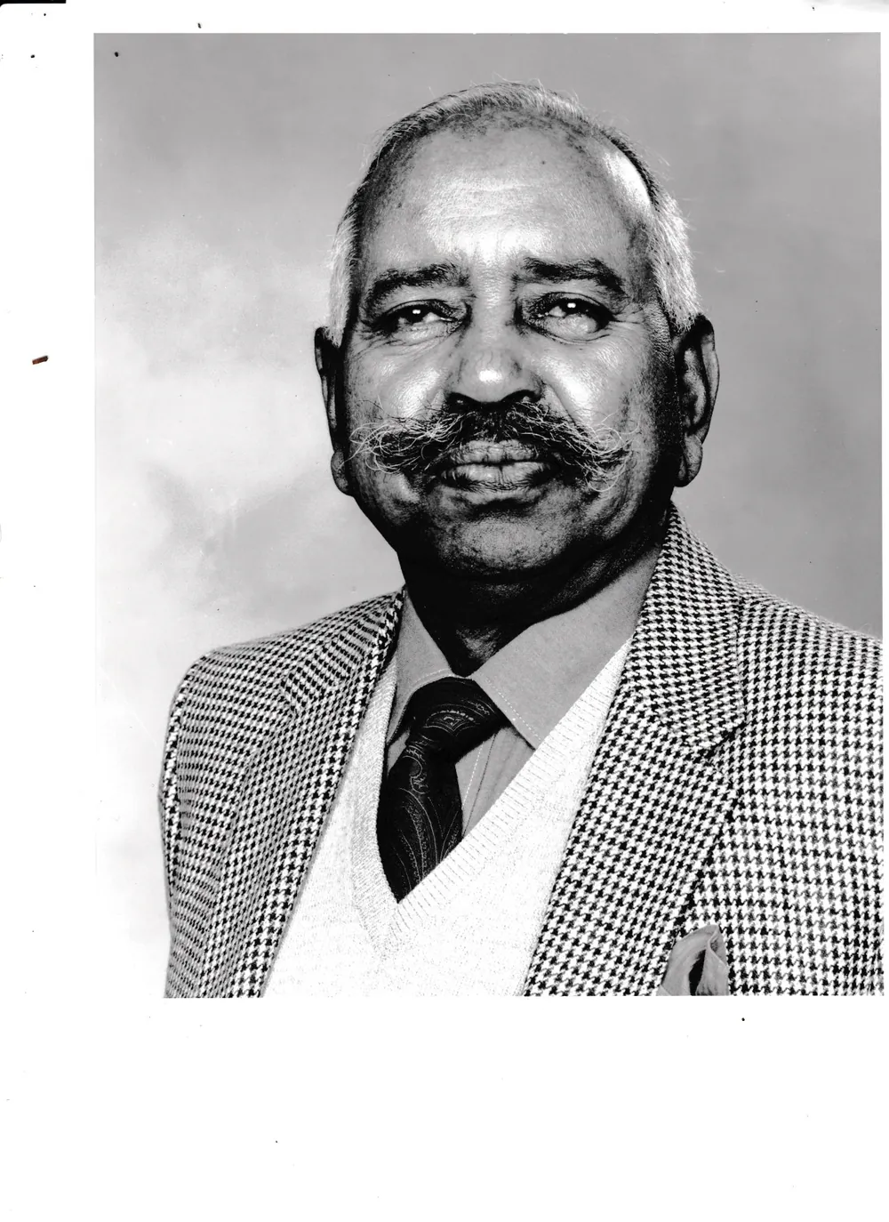 Portrait in a houndstooth jacket.