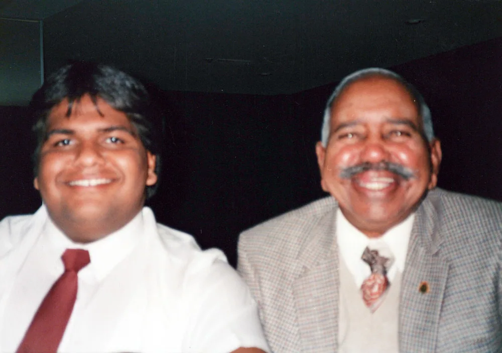 Two men photographed together.