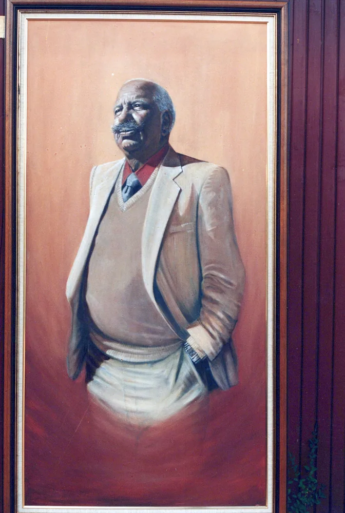 A framed painted portrait.