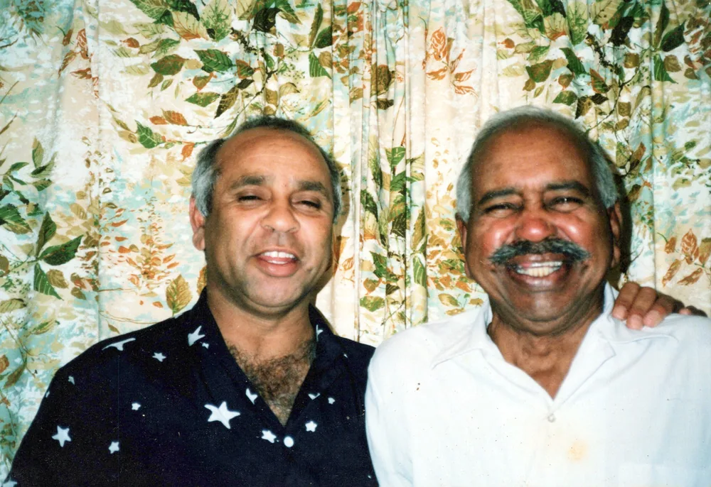 Two men at a gathering.